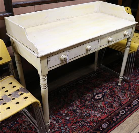 A painted two drawer side table, with tray top W.115cm
